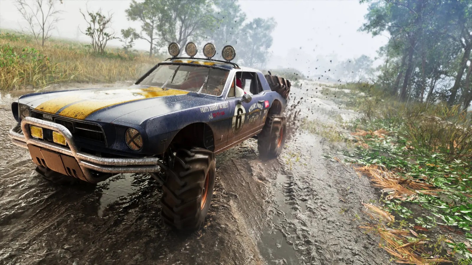 A mud-spattered number 6 off-road coupe